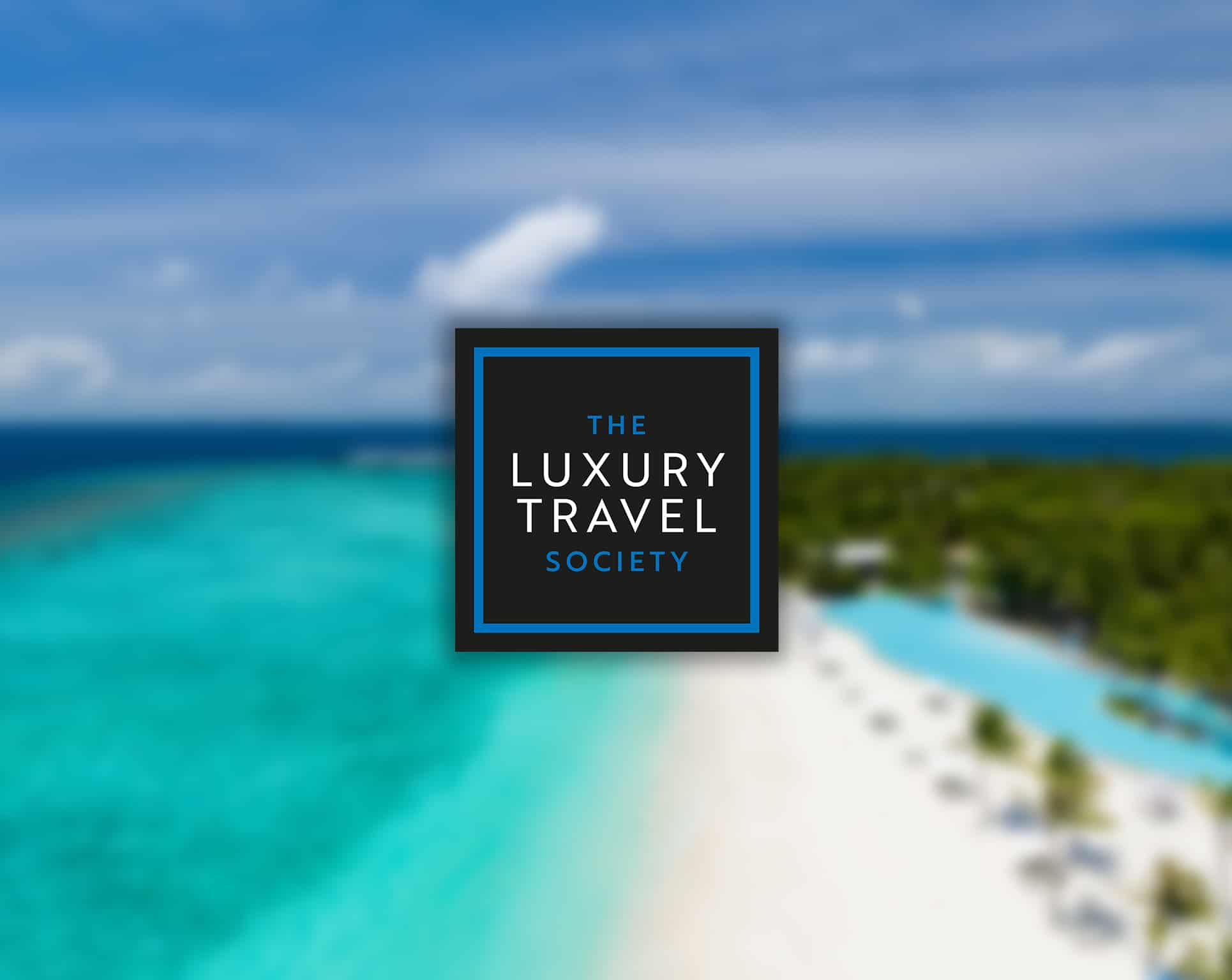 the luxury travel society logo with maldives sea in the background