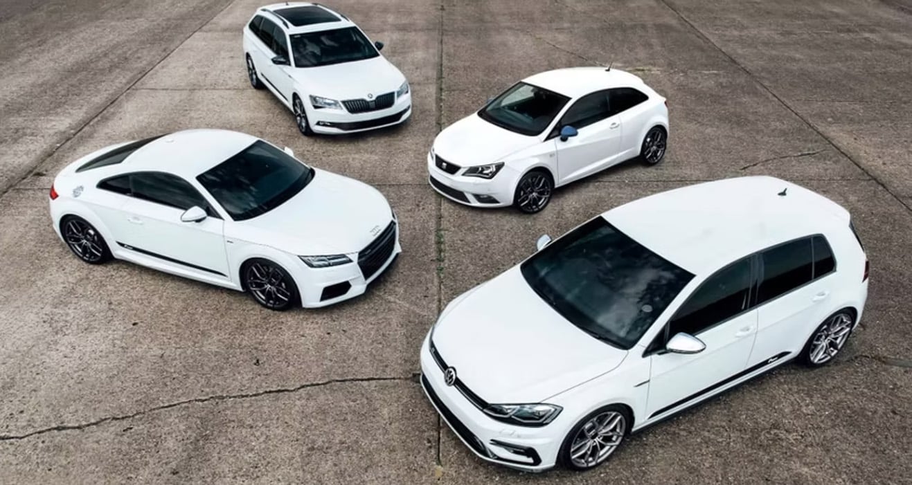 white VAG cars on a runway